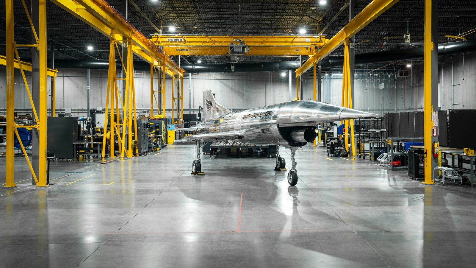 a jet plane parked inside of a hangar