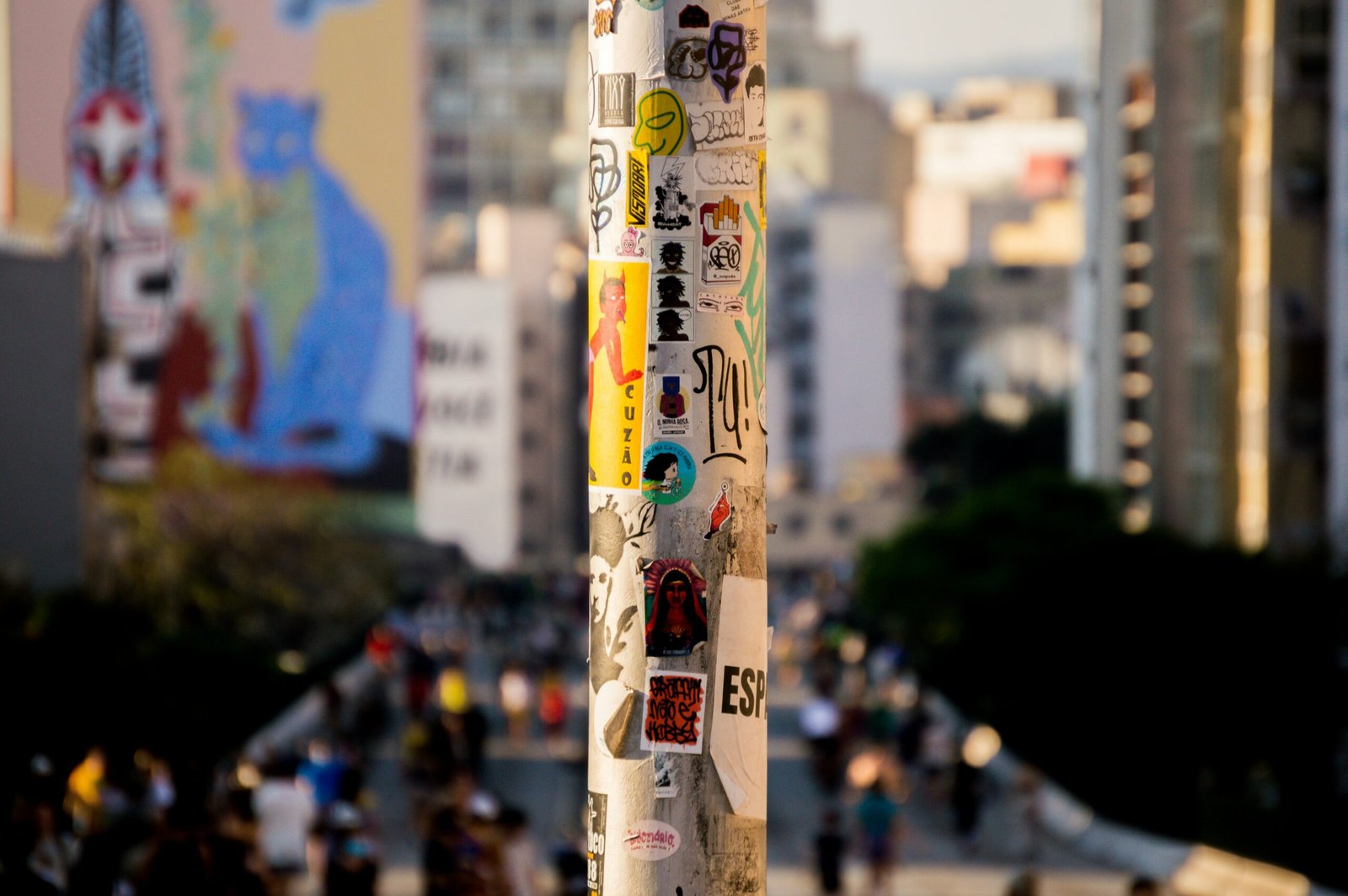 a pole with a bunch of stickers on it