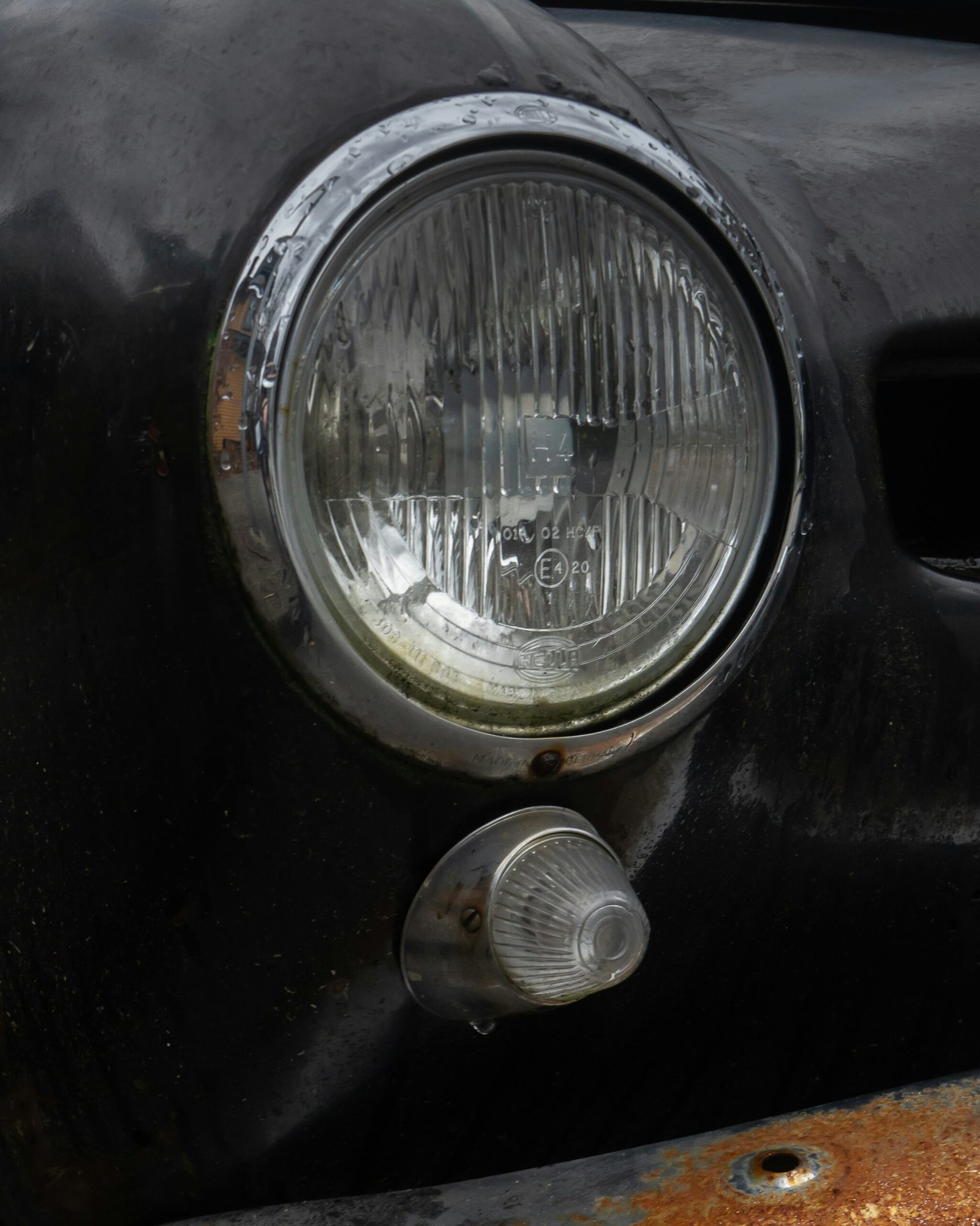 a close up of a headlight on an old car